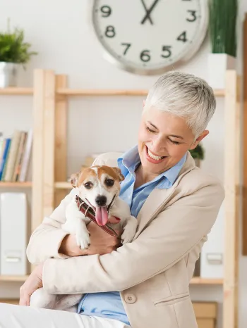 Woman and her dog in the workplace